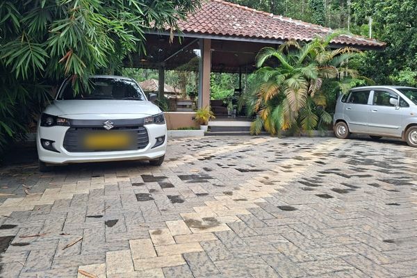 B&B Tours and Travels cars parked at a hill station homestay in Kerala